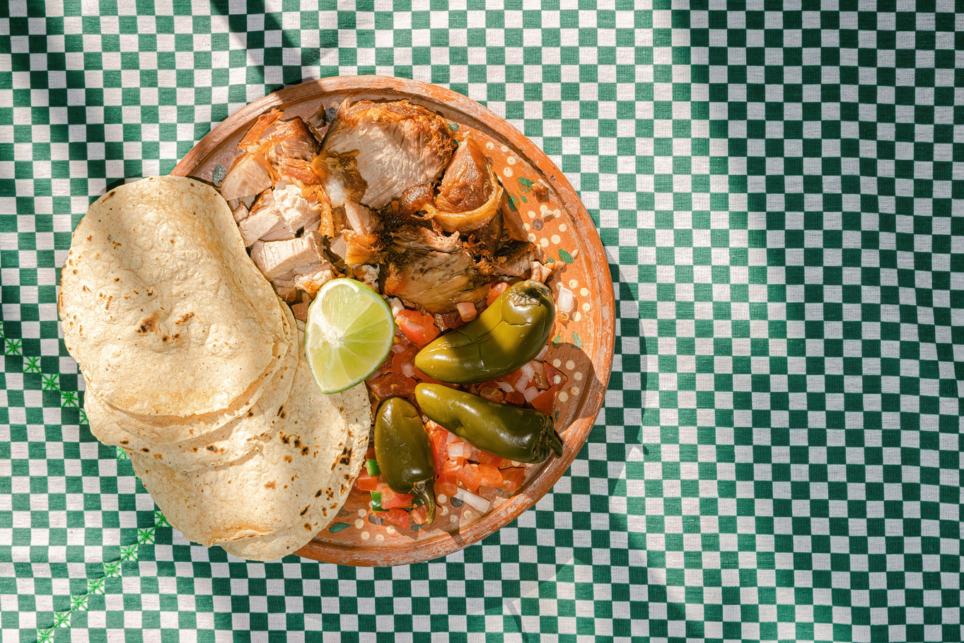 Carnitas on Decorated Clay Dish Flatlay